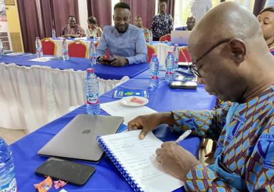 Mr. James Owusu, Ag. Chief Finance Officer Signing Proposal Documents